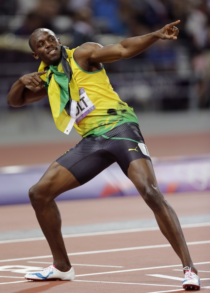 Jamaica's Usain Bolt celebrates winning gold in the men's 200-meter final during the athletics in the Olympic Stadium at the 2012 Summer Olympics, London, Thursday, Aug. 9, 2012. (AP Photo/David J. Phillip)